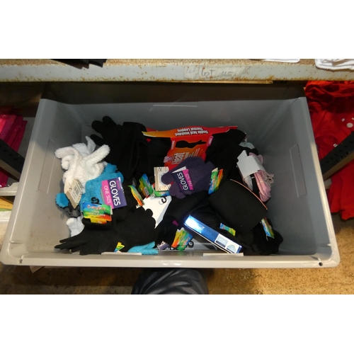 2613 - A crate containing a quantity of various socks and gloves inc children's gloves, crate not included