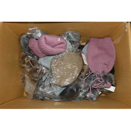 2624 - A box containing 20 various wooly hats