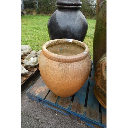 2692 - A concrete urn shaped planter, no handles