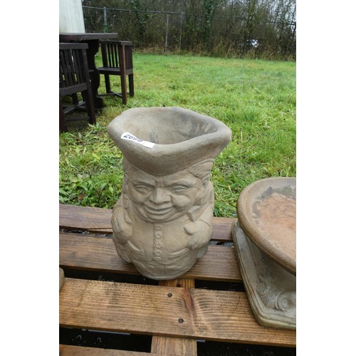 2699 - A concrete Toby jug style planter