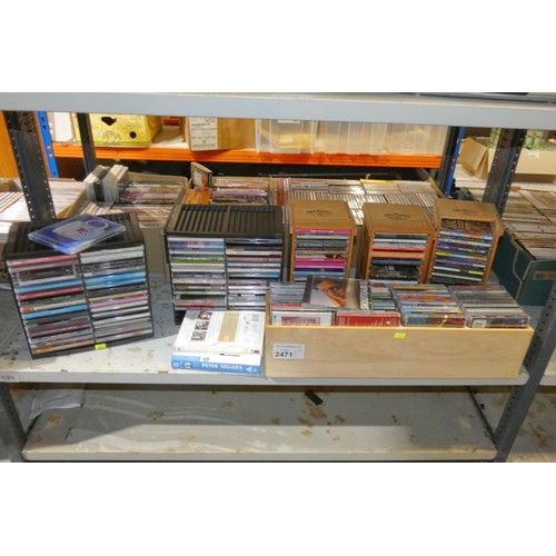 2471 - A quantity of various CDs in wooden display cases, contents of 1 shelf