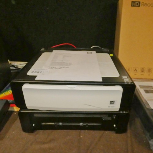 2501 - 2 x office printers by Ricoh type SP100e one missing front panel - trade. Tested working