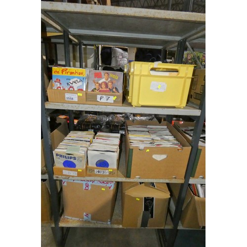 2558 - A quantity of various 45rpm single vinyl records, contents of 3 shelves