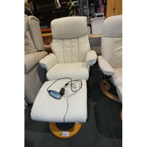 2188 - A cream upholstered reclining armchair with built in 240v massage feature and a matching foot stool.... 