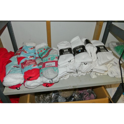 2623 - A quantity of various Christmas slipper socks and white sport socks, contents of 1 shelf