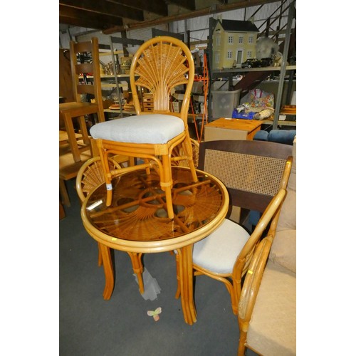 2144 - A glass topped round conservatory type table with 4 x matching chairs