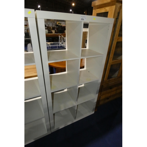 319 - A  white cubed shelving unit with 8 storage sections approx 79x39x150cm