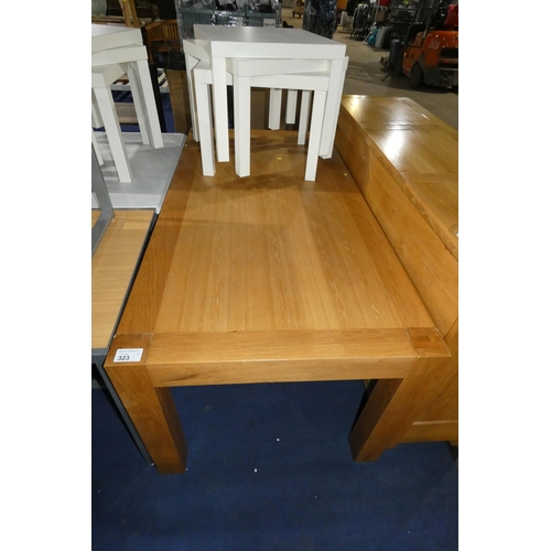 323 - A large oak table approx 180x90cm, legs can be removed for transportation