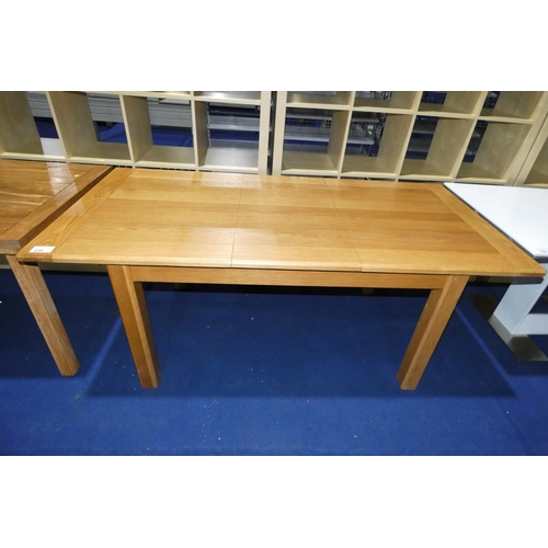 335 - An oak extending dining table approx 140x90cm - 185x90cm extended