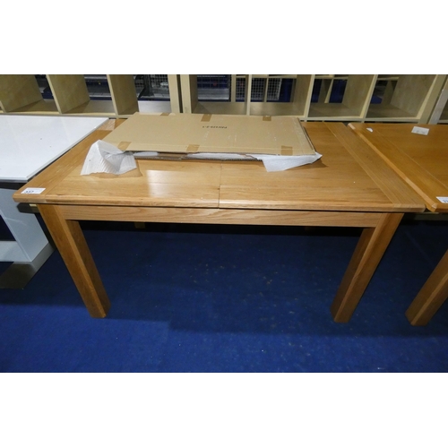 337 - An oak extending dining table approx 140x90cm - 186cm extended