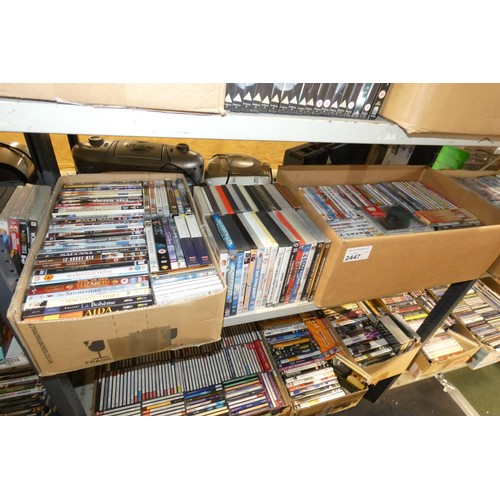 2447 - A large quantity of various DVDs and CDs, contents of 3 shelves