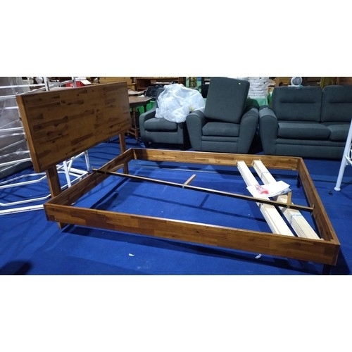 373 - A wooden 5ft king size bed frame, please note one leg requires a repair