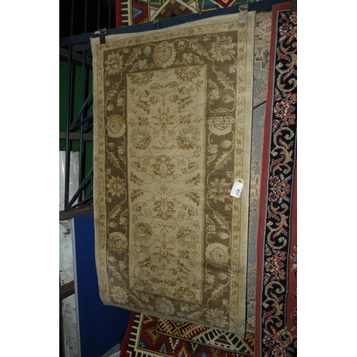 258 - An ivory ground patterned rug approx 80*150cm