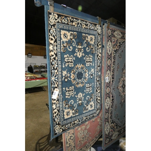 259 - A blue ground patterned rug approx 60*104cm