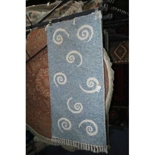 262 - A blue ground patterned bathroom rug approx 66*150cm