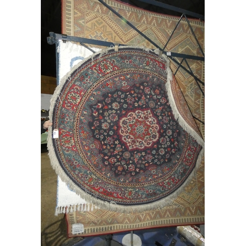 263 - A round blue ground patterned rug approx 160cm