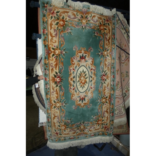 267 - A green/blue ground patterned rug approx 125x220cm