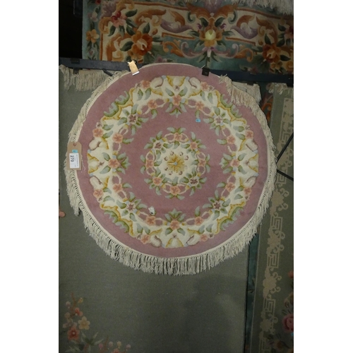 270 - A round pink ground patterned rug approx 95cm