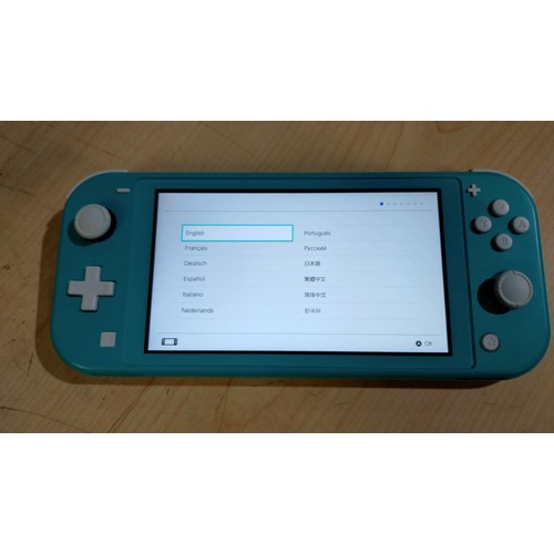 2526 - A Nintendo switch Lite console, boxed with charger & comes with an official Nintendo soft carry case... 