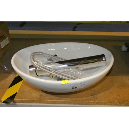 68 - 1 x white ceramic oval basin approx 41cm wide and 1 x chrome post tap. Please note that the waste ho... 