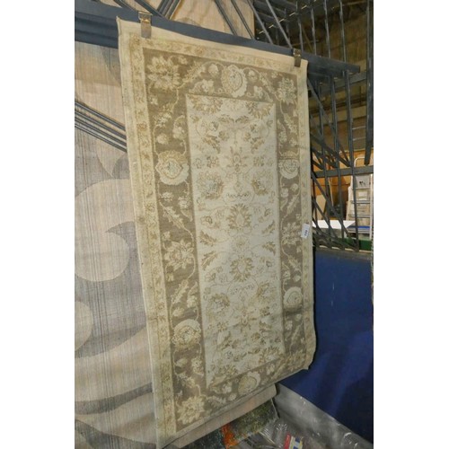 199 - An ivory ground patterned rug approx 80 x 150cm