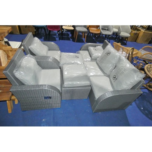 465 - A grey synthetic rattan garden seating group with cushions comprising 1 x three seat sofa, 2 x chair... 