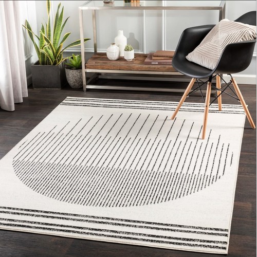 551 - 1 x Corum black / off white rug approx 200 x 274cm RRP £69