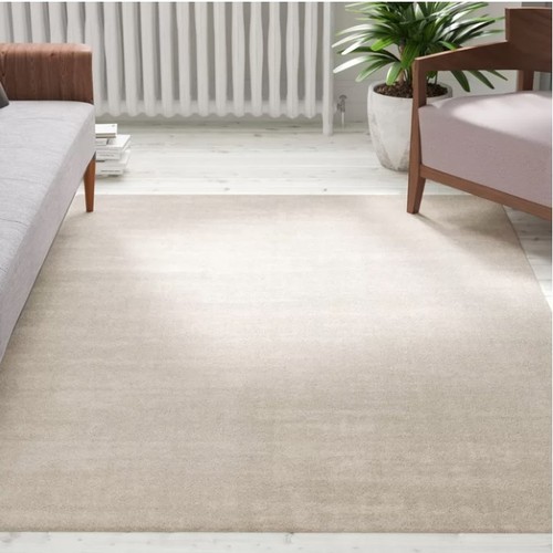 557 - 1 x Tiffany low pile semi-plain shaggy cream rug approx 160 x 230cm RRP £167