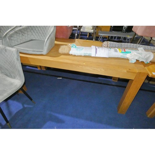 526 - A large oak table approx 180 x 90cm, legs can be removed for transportation