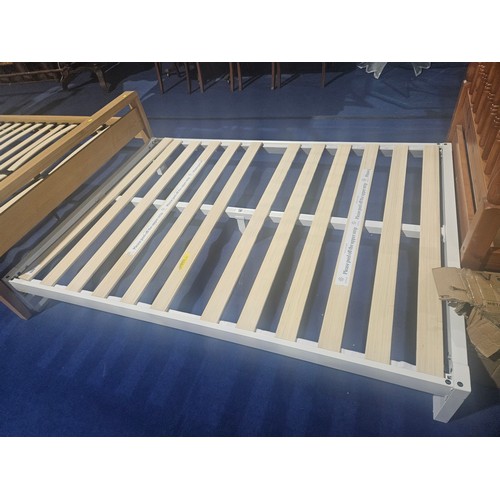 585 - A white metal Euro size bed frame 135cm wide. Please note no mattress or head board is included