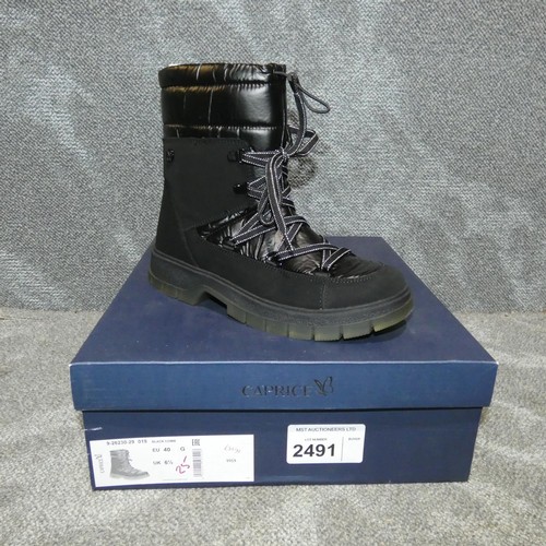 2491 - A pair of ladies boots by Caprice type Black Comb size 6.5 RRP £84