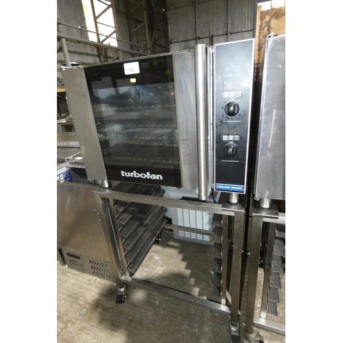 1194 - A turbo fan oven by Blue Seal type E31D4 with mobile stand/tray rack 240v - trade