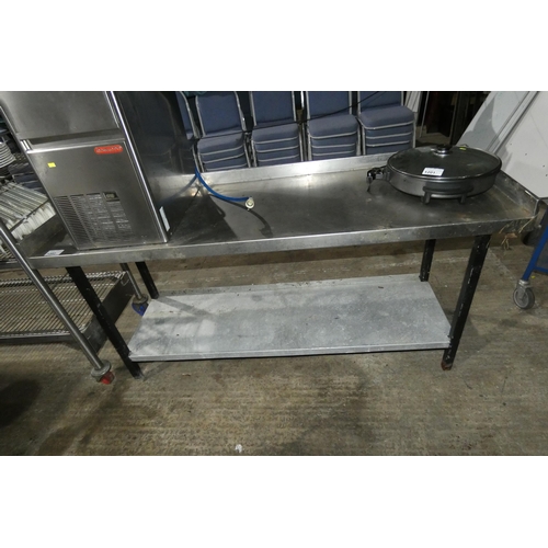 1202 - A commercial stainless steel catering type table with shelf beneath approx 185x62cm