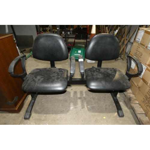 2062 - A black upholstered 2 seater salon bench