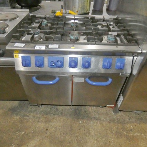 1182 - A commercial stainless steel gas fired 6 burner range with double door oven beneath by Electrolux  -... 