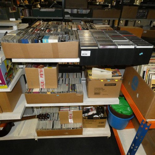 2630 - A quantity of various items including CDs & books etc. Contents of 3 shelves