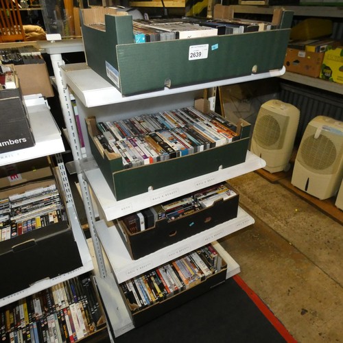 2639 - A large quantity of various DVDs and CDs, contents of 4 shelves