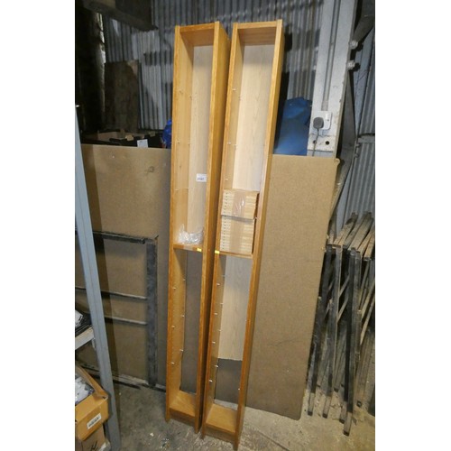 2107 - 2 x tall wood effect CD shelf units each approx 20 x 17 x 203cm high. Please note that the back pane... 