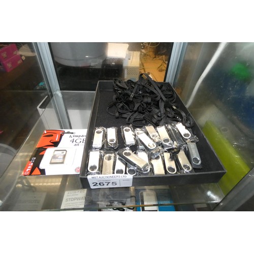 2675 - A quantity of 2gb usb storage dongles by Gore-tex with neck straps and a 4gb SD card by Kingston