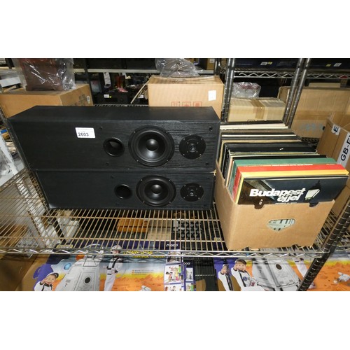 2603 - A pair of tall acoustic solutions speakers and a quantity of various vinyl records