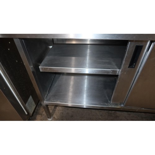 1146 - A commercial stainless steel catering type 2 sliding door cabinet approx 147x65cm , please note unit... 