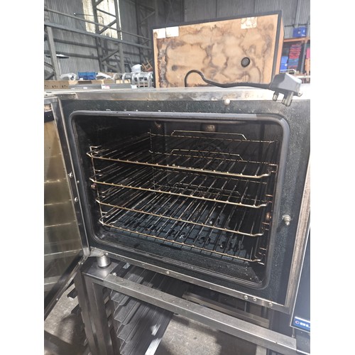 1193 - A turbo fan oven by Blue Seal type E31D4 with mobile stand/tray rack 240v - trade