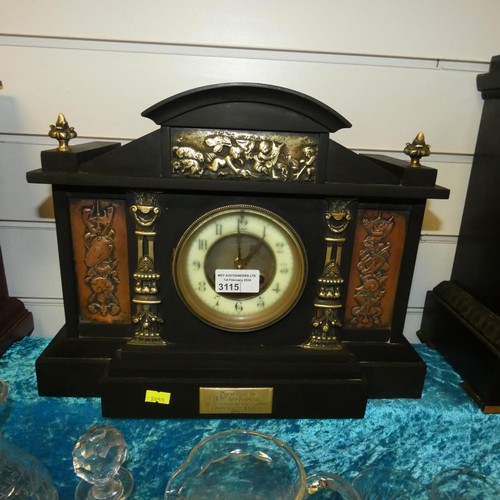 3115 - An Edwardian black marble case temple style mantle clock with brass mounts