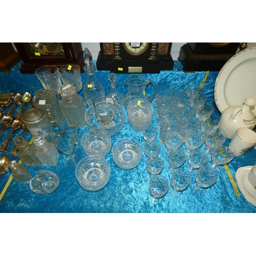 3117 - A quantity of various cut glass decanters, cut glass jugs and bowls and cut glass drinking glasses e... 