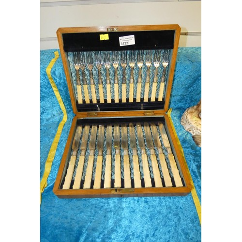 3122 - A boxed set of silver plated a fruit knives and forks with bone handles