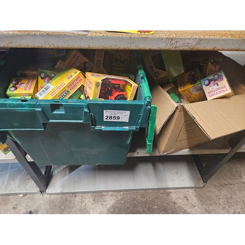 2859 - 2 x boxes of friction powered toy tractors by Farmer Giles