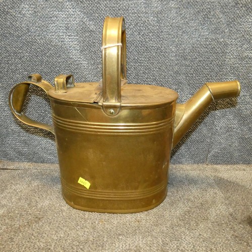 3040 - An oval copper fish kettle, a brass watering can and a quantity of miscellaneous decorative brass or... 