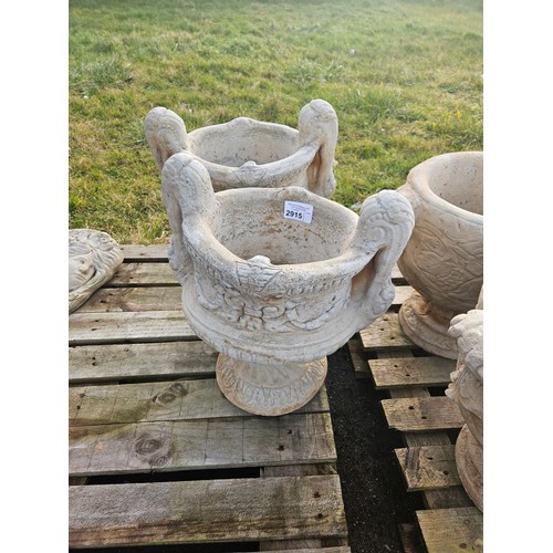 2915 - A pair of large concrete 2 handled urn type planters