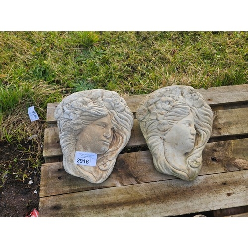 2916 - 2 x matching concrete wall plaques of ladies faces