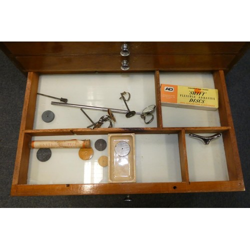 3095 - A vintage dentist's seven drawer mahogany cabinet containing dental instruments and equipment